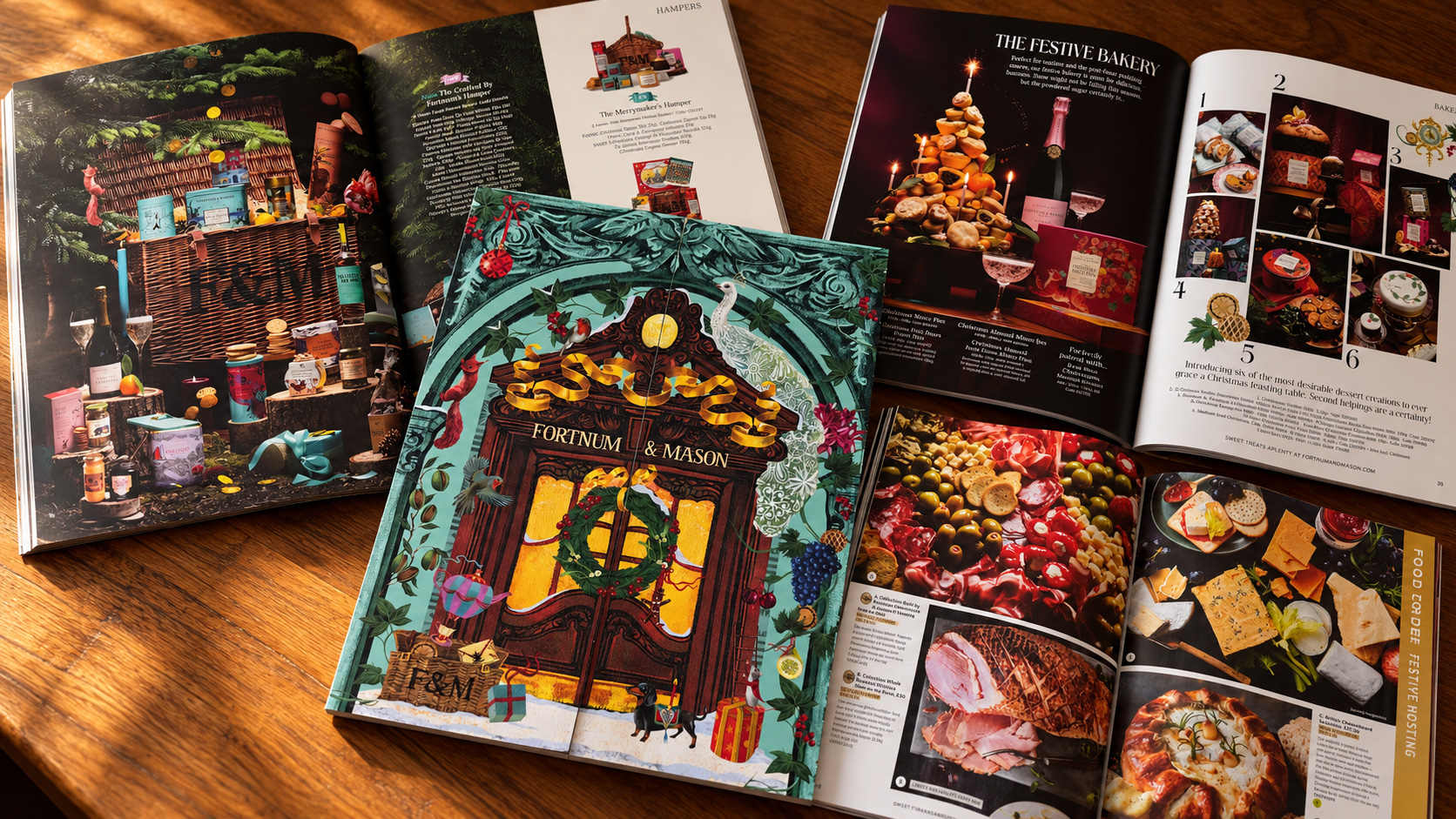 Printed Christmas catalogues from Fortnum & Mason and M&S, showing festive illustrations and food photography